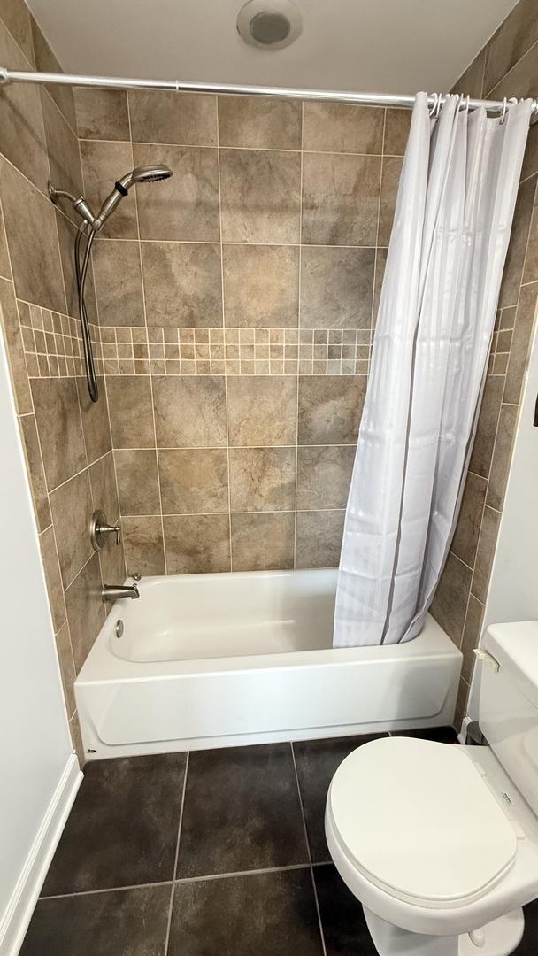1841 S Calumet Ave Unit 2102, Chicago, IL 60616 - full bath with shower / bath combo with shower curtain and tile patterned floors