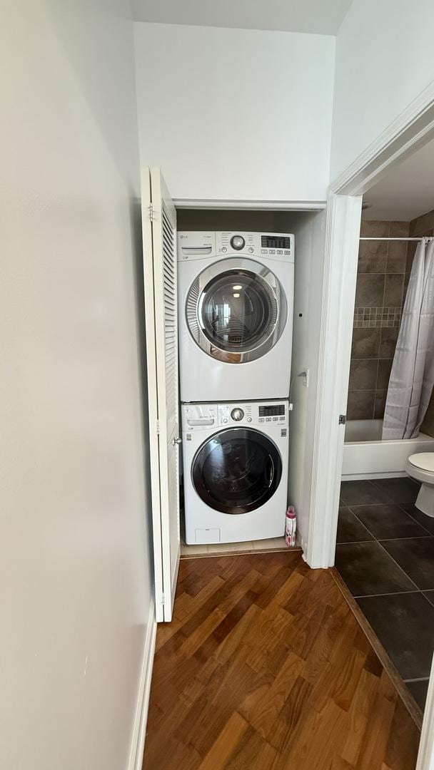 1841 S Calumet Ave Unit 2102, Chicago, IL 60616 - washroom featuring stacked washer and clothes dryer and wood finished floors