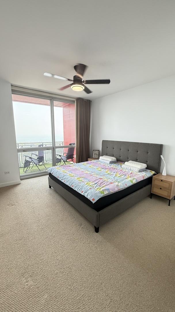 1841 S Calumet Ave Unit 2102, Chicago, IL 60616 - carpeted bedroom featuring a ceiling fan