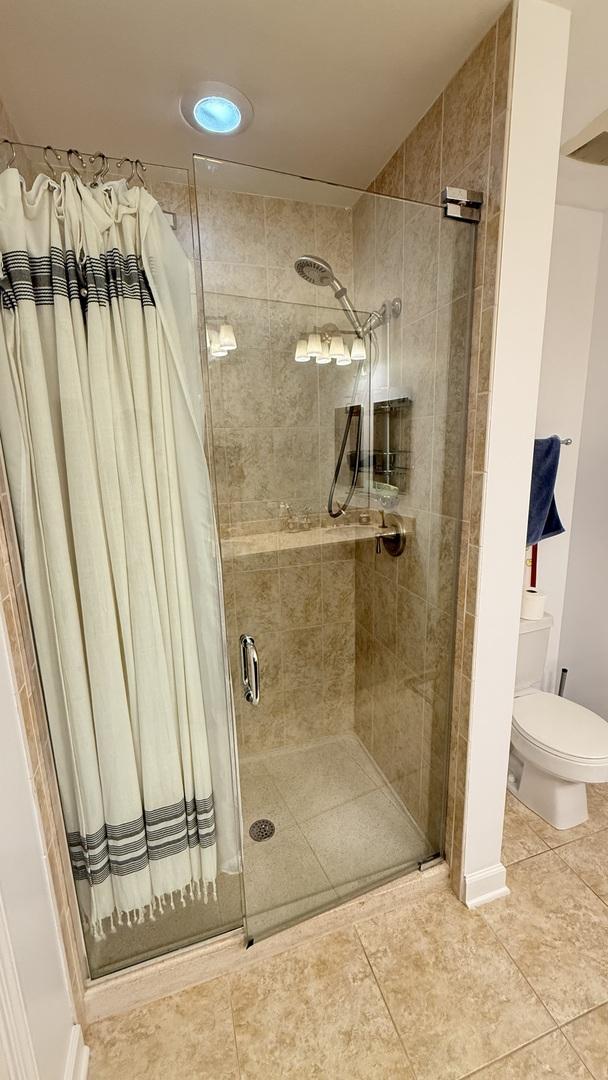 1841 S Calumet Ave Unit 2102, Chicago, IL 60616 - bathroom with a stall shower and tile patterned flooring