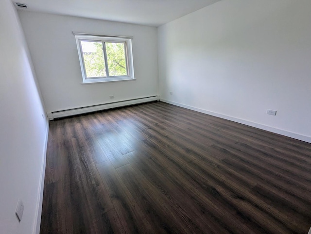 2315 E Olive St Unit 3G, Arlington Heights, IL 60004 - spare room with baseboard heating and dark wood-type flooring