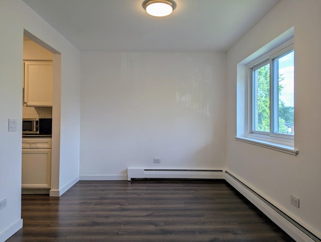 2315 E Olive St Unit 3G, Arlington Heights, IL 60004 - empty room with a baseboard radiator and dark wood-type flooring