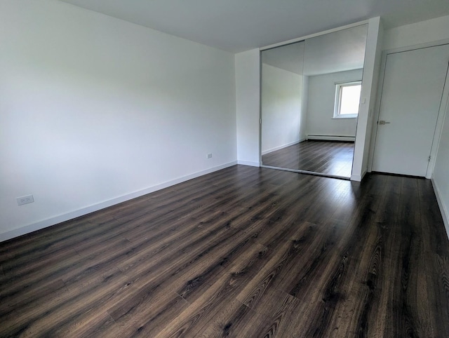 2315 E Olive St Unit 3G, Arlington Heights, IL 60004 - unfurnished bedroom with a baseboard heating unit, dark wood-type flooring, and a closet