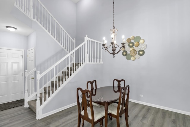 1850 Maureen Dr, Hoffman Estates, IL 60192 - dining room featuring wood finished floors, stairway, and a chandelier