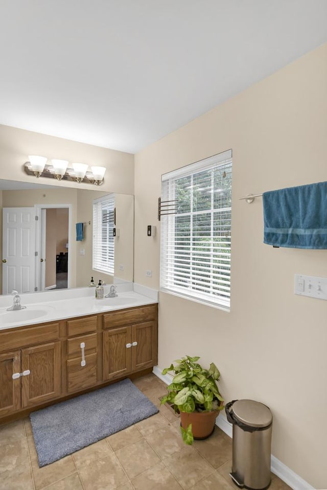 1850 Maureen Dr, Hoffman Estates, IL 60192 - bathroom featuring double vanity, healthy amount of natural light, and tile patterned flooring