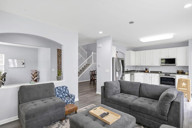 1850 Maureen Dr, Hoffman Estates, IL 60192 - living area featuring stairs, wood finished floors, recessed lighting, and arched walkways