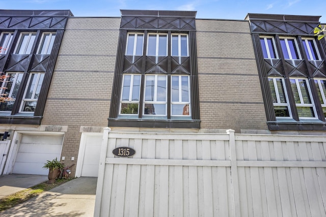 1315 W Webster Ave, Chicago, IL 60614 - exterior view of brick siding and concrete driveway
