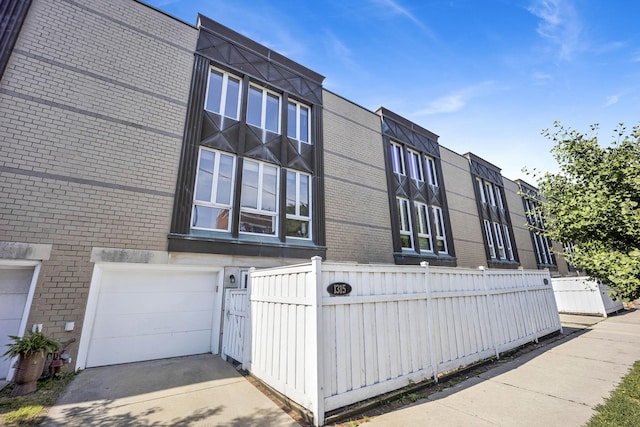 1315 W Webster Ave, Chicago, IL 60614 - view of property with a garage and concrete driveway