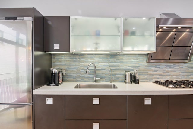 1529 W Chestnut St Unit 102, Chicago, IL 60642 - kitchen with stainless steel appliances, modern cabinets, light countertops, and dark brown cabinets