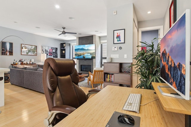 1529 W Chestnut St Unit 102, Chicago, IL 60642 - home office with ceiling fan, wood finished floors, a fireplace, and recessed lighting