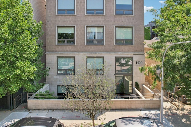 1529 W Chestnut St Unit 102, Chicago, IL 60642 - view of front facade featuring brick siding