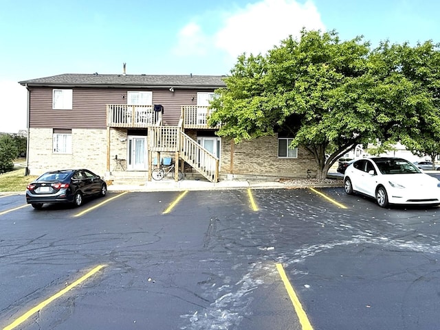 1411 Berta Dr Unit 2N, Crest Hill, IL 60403 - view of property with uncovered parking and stairs