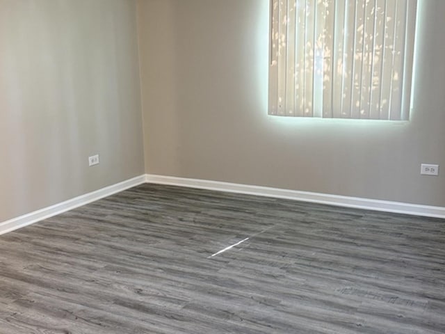 1411 Berta Dr Unit 2N, Crest Hill, IL 60403 - spare room with baseboards and wood finished floors
