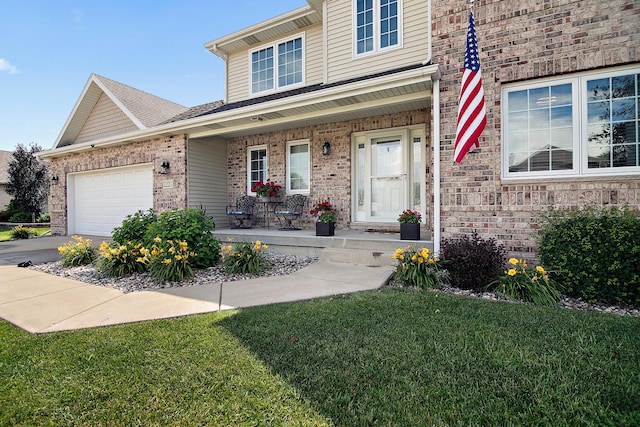 2225 Prairie Chase Dr, Bourbonnais, IL 60914 - traditional-style house featuring covered porch, brick siding, an attached garage, and a front lawn
