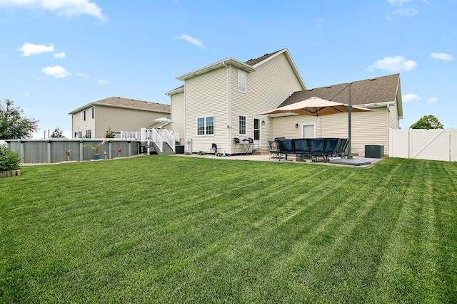 2225 Prairie Chase Dr, Bourbonnais, IL 60914 - back of property featuring a patio area, an outdoor living space, stairway, and a wooden deck