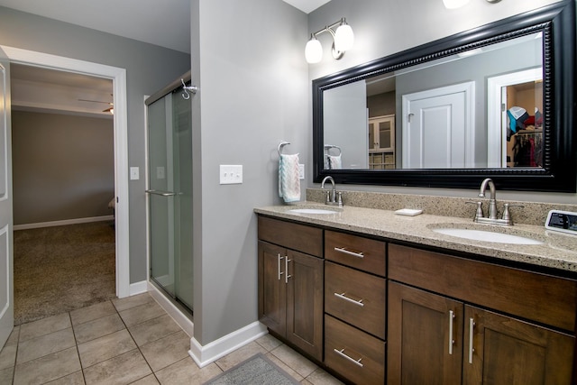 2225 Prairie Chase Dr, Bourbonnais, IL 60914 - full bathroom featuring double vanity, a stall shower, tile patterned flooring, and a spacious closet