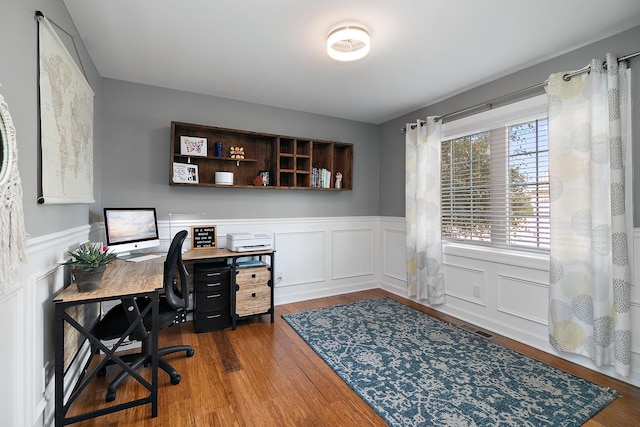 2225 Prairie Chase Dr, Bourbonnais, IL 60914 - office space featuring a wainscoted wall, wood finished floors, and a decorative wall