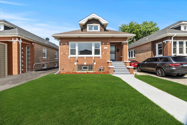 1706 S 9th Ave, Maywood, IL 60153 - view of front facade with a front yard and brick siding