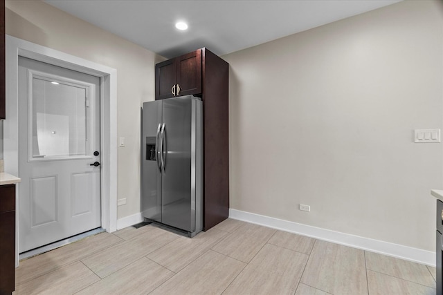 1706 S 9th Ave, Maywood, IL 60153 - kitchen with stainless steel fridge, light countertops, dark brown cabinetry, wood finish floors, and recessed lighting