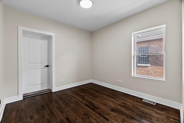 1706 S 9th Ave, Maywood, IL 60153 - spare room with dark wood-style flooring and baseboards