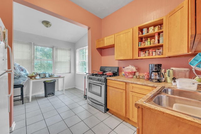 5347 S Racine Ave, Chicago, IL 60609 - kitchen featuring stainless steel gas range, light brown cabinets, light tile patterned flooring, light countertops, and open shelves