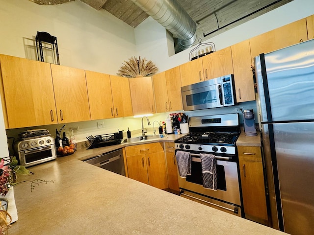 900 N Kingsbury St Unit 861, Chicago, IL 60610 - kitchen with stainless steel appliances, a high ceiling, light countertops, and light brown cabinetry