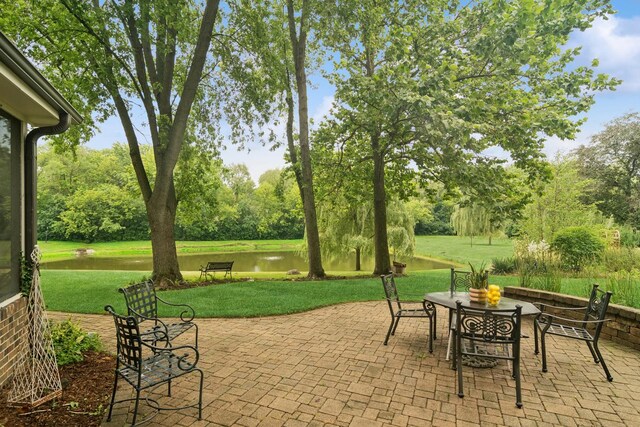 870 Georgetowne Ln, Barrington, IL 60010 - view of patio featuring a water view, view of wooded area, and outdoor dining area