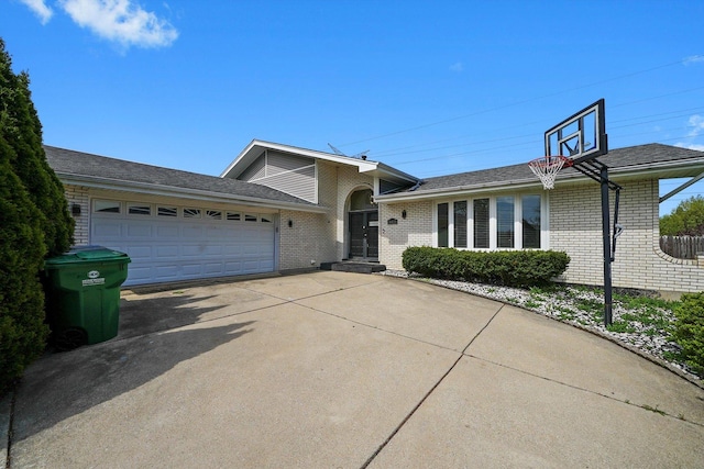 14424 S Pheasant Ln, Homer Glen, IL 60491 - split level home with brick siding, an attached garage, concrete driveway, and a shingled roof