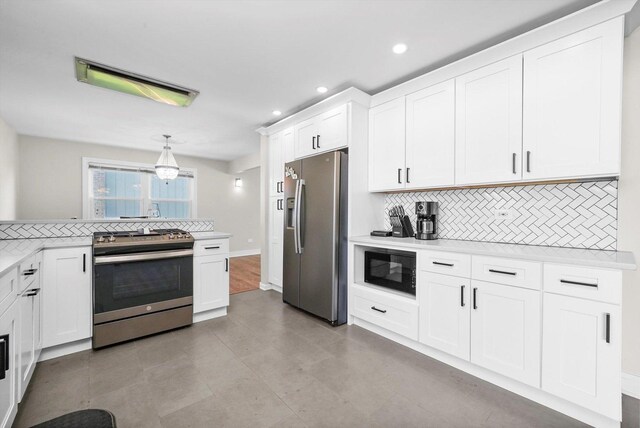 14424 S Pheasant Ln, Homer Glen, IL 60491 - kitchen featuring appliances with stainless steel finishes, tasteful backsplash, light countertops, white cabinets, and recessed lighting