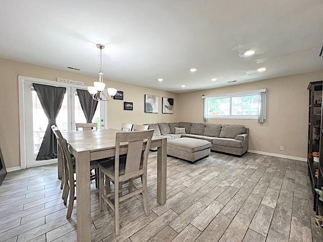 534 White Oak Rd, Bolingbrook, IL 60440 - dining space featuring light wood-style floors, a chandelier, and recessed lighting