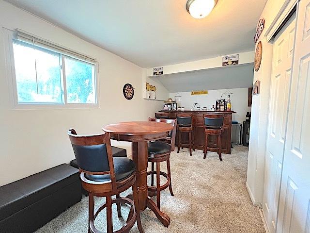 534 White Oak Rd, Bolingbrook, IL 60440 - dining room featuring wet bar and light carpet