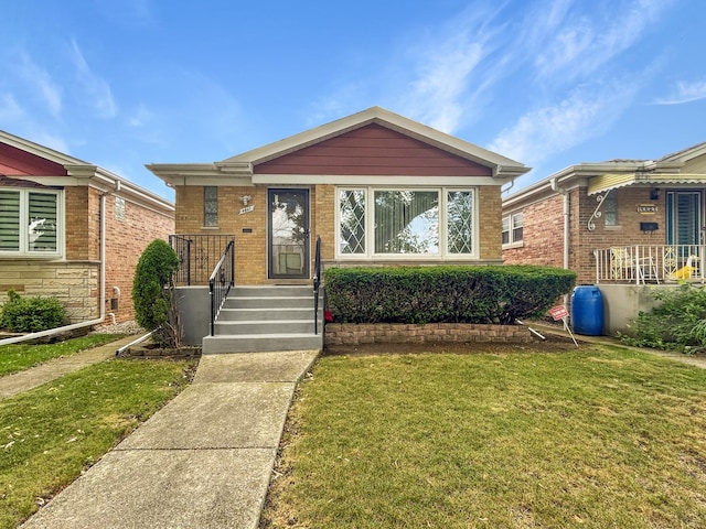 4841 N Natchez Ave, Chicago, IL 60656 - view of front of property featuring a front lawn and brick siding