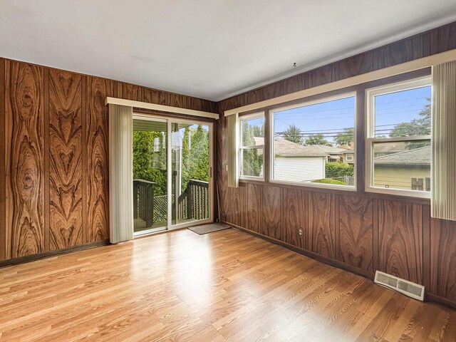 4841 N Natchez Ave, Chicago, IL 60656 - unfurnished room with wooden walls and light wood finished floors