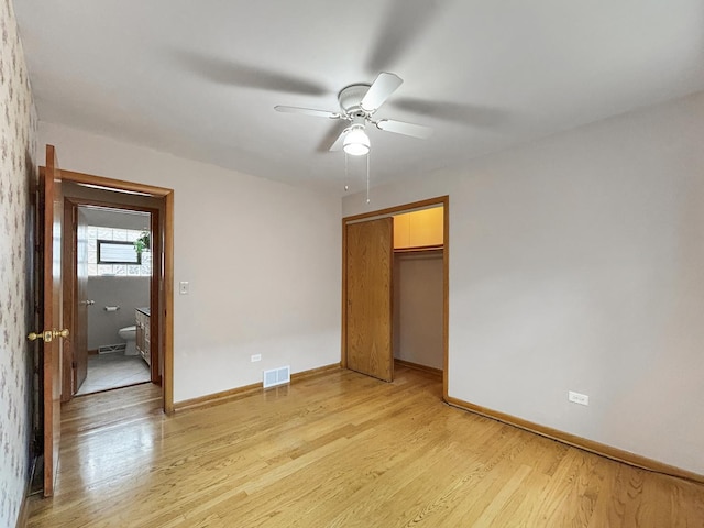4841 N Natchez Ave, Chicago, IL 60656 - unfurnished bedroom featuring light wood-style floors, a closet, and ceiling fan