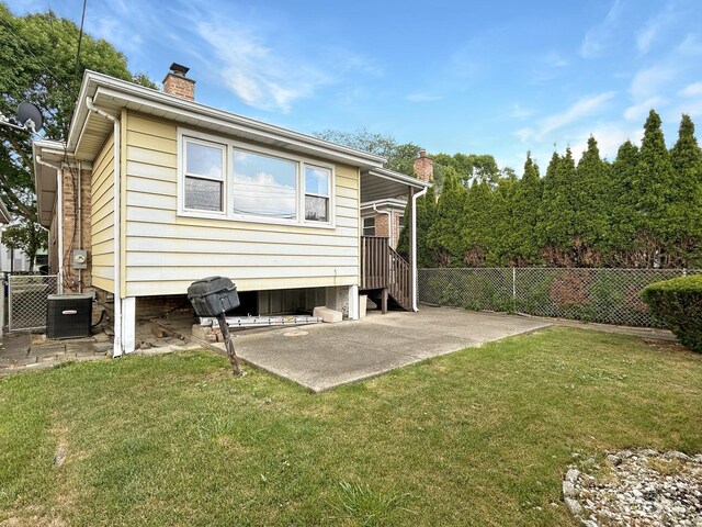 4841 N Natchez Ave, Chicago, IL 60656 - back of property with a chimney and a patio area