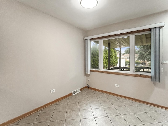 4841 N Natchez Ave, Chicago, IL 60656 - spare room featuring baseboards and light tile patterned floors