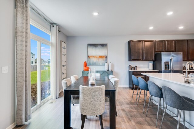 2893 Killarny Dr, Elgin, IL 60124 - dining area with light wood finished floors and recessed lighting