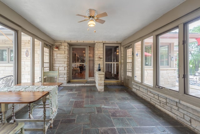 1090 Roselle Rd, Inverness, IL 60067 - unfurnished sunroom featuring stone tile floors and a ceiling fan