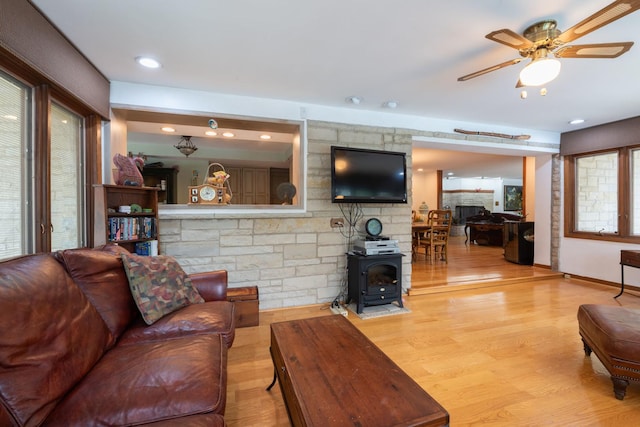 1090 Roselle Rd, Inverness, IL 60067 - living area featuring a wood stove, wood finished floors, and ceiling fan