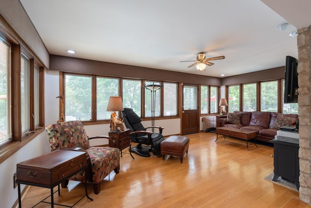1090 Roselle Rd, Inverness, IL 60067 - living room featuring a wood stove, ceiling fan, light wood-style floors, and recessed lighting