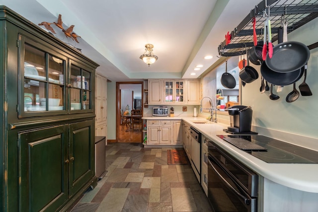 1090 Roselle Rd, Inverness, IL 60067 - kitchen with oven, stone tile floors, black electric stovetop, stainless steel microwave, and light countertops