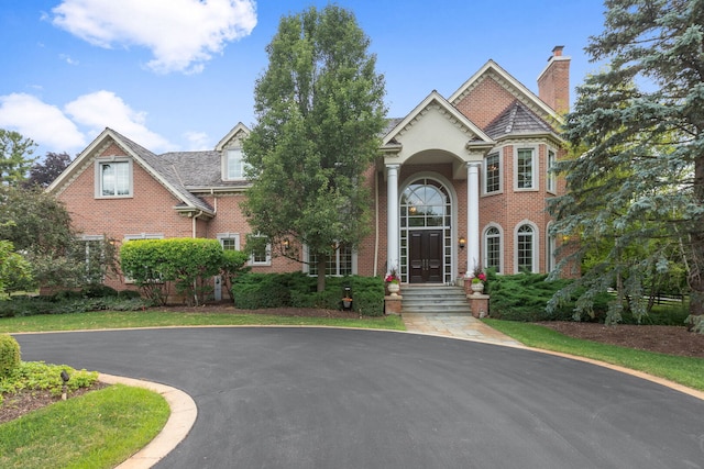 590 Merri Oaks Rd, Barrington Hills, IL 60010 - view of front of home featuring brick siding and a chimney