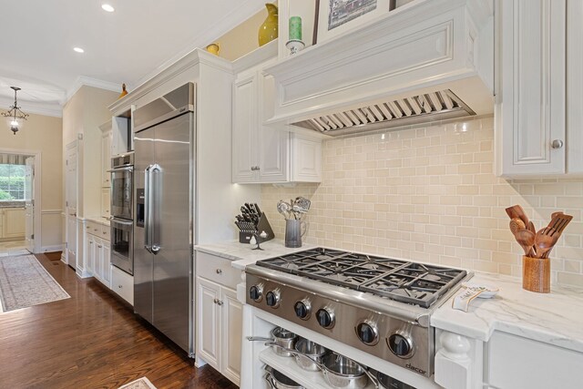 590 Merri Oaks Rd, Barrington Hills, IL 60010 - kitchen featuring custom range hood, appliances with stainless steel finishes, crown molding, white cabinetry, and light stone counters