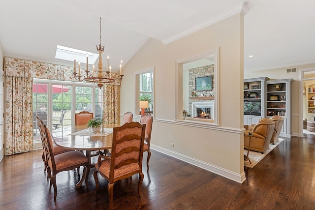 590 Merri Oaks Rd, Barrington Hills, IL 60010 - dining room featuring ornamental molding, a chandelier, a glass covered fireplace, dark wood finished floors, and vaulted ceiling