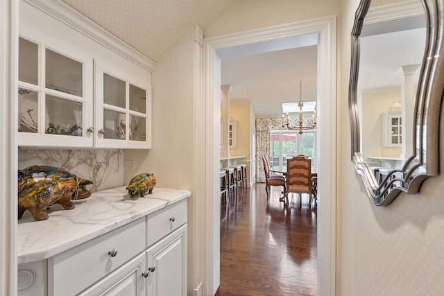 590 Merri Oaks Rd, Barrington Hills, IL 60010 - hall featuring wallpapered walls, dark wood finished floors, a chandelier, and ornamental molding