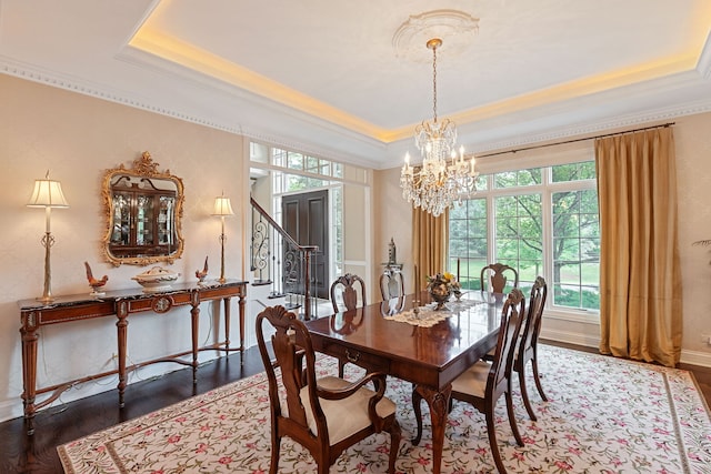 590 Merri Oaks Rd, Barrington Hills, IL 60010 - dining space featuring a tray ceiling, crown molding, wood finished floors, and a chandelier