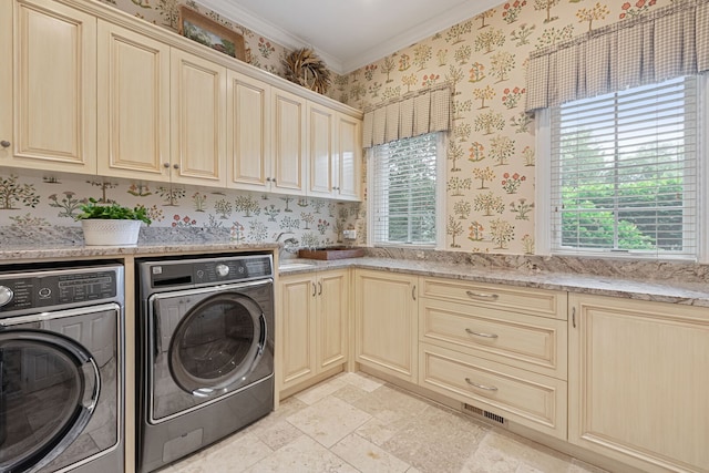 590 Merri Oaks Rd, Barrington Hills, IL 60010 - laundry room with washing machine and dryer, cabinet space, stone tile floors, wallpapered walls, and ornamental molding