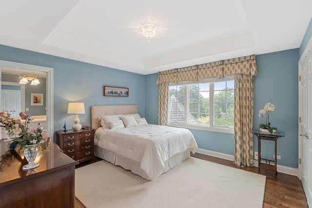 590 Merri Oaks Rd, Barrington Hills, IL 60010 - bedroom with a raised ceiling and dark wood-type flooring