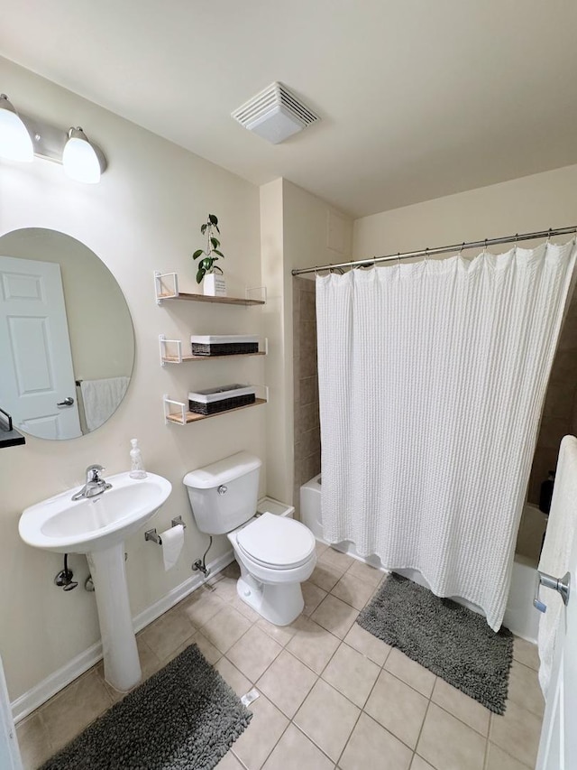 656 Pearson St Unit 512C, Des Plaines, IL 60016 - bathroom featuring shower / bath combo with shower curtain and tile patterned floors