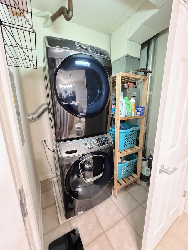 656 Pearson St Unit 512C, Des Plaines, IL 60016 - laundry room featuring stacked washer / drying machine and tile patterned flooring